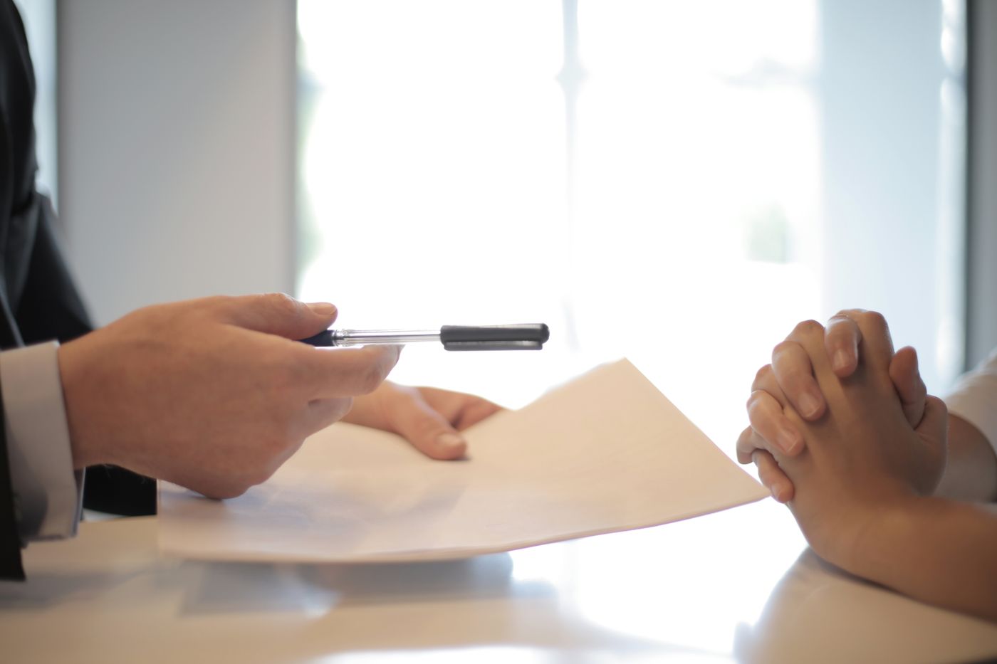Licensed local insurance agent reviewing coverage documents with a client